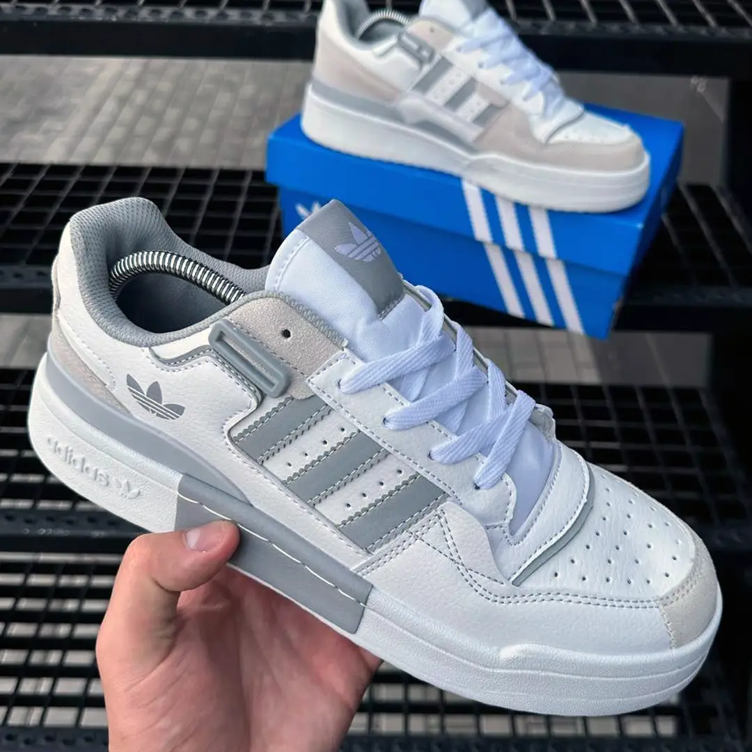 Взуття Кросівки Adidas Ozweego (brown) Магазин Орхідея Кросівки Adidas Forum low (white & gray)